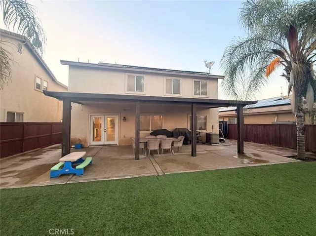 a view of yard with swimming pool and green space
