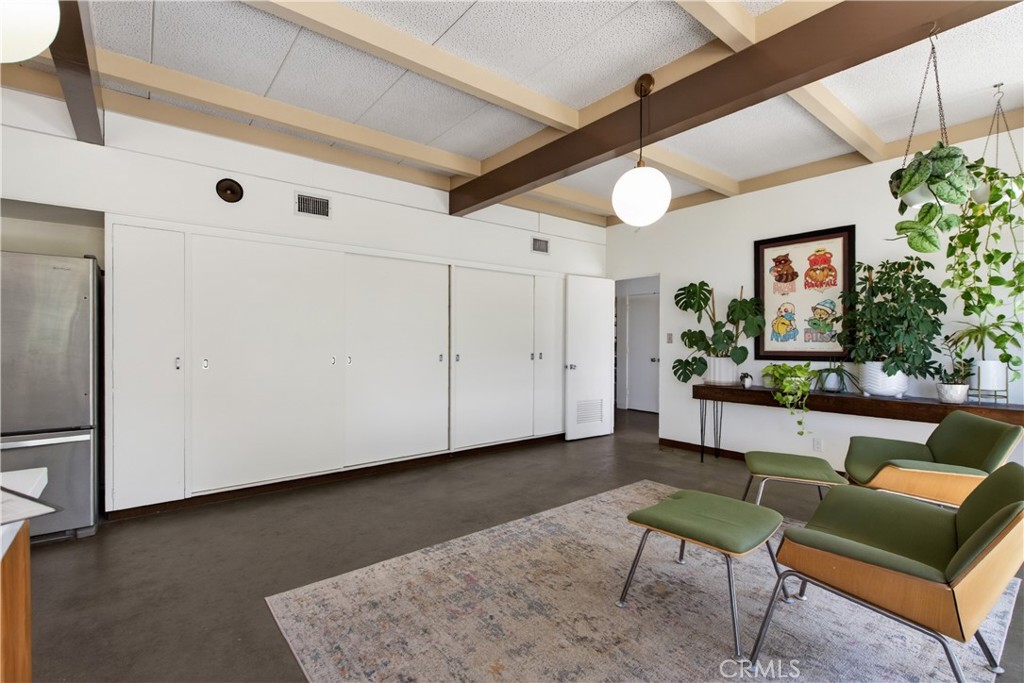11407 Eton Lane Riverside, CA 92507 - Photo 23 of 47 a living room with furniture and a chandelier