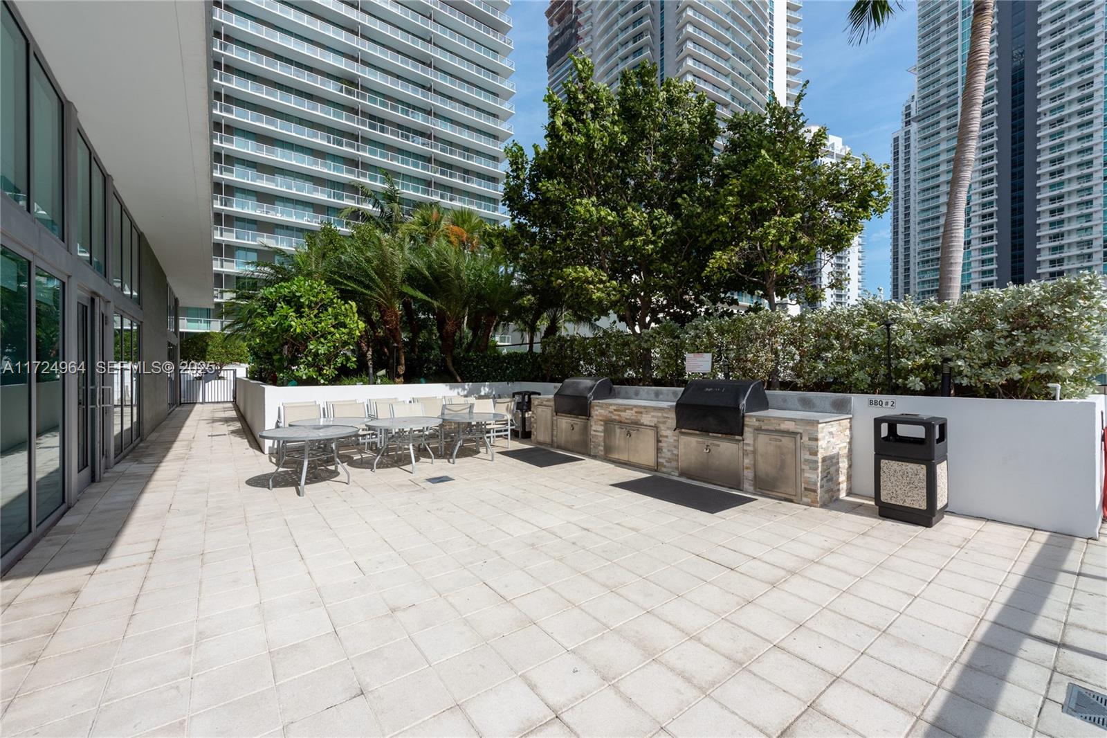 79 Southwest 12th Street, Unit 1107S Miami, FL 33130 - Photo 22 of 26 a view of backyard with a sitting area and furniture