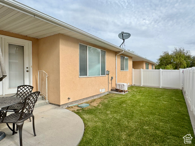 445 Topaz Boulevard, Unit 10 Delta, UT 84624 - Photo 22 of 28 View of yard featuring a patio area