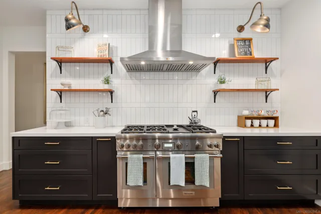 a kitchen with a stove and cabinets