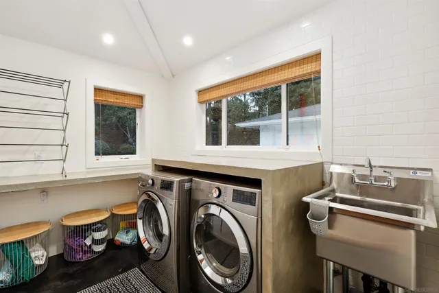 a view of a kitchen with a sink and a window