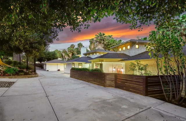 a view of a balcony with a yard