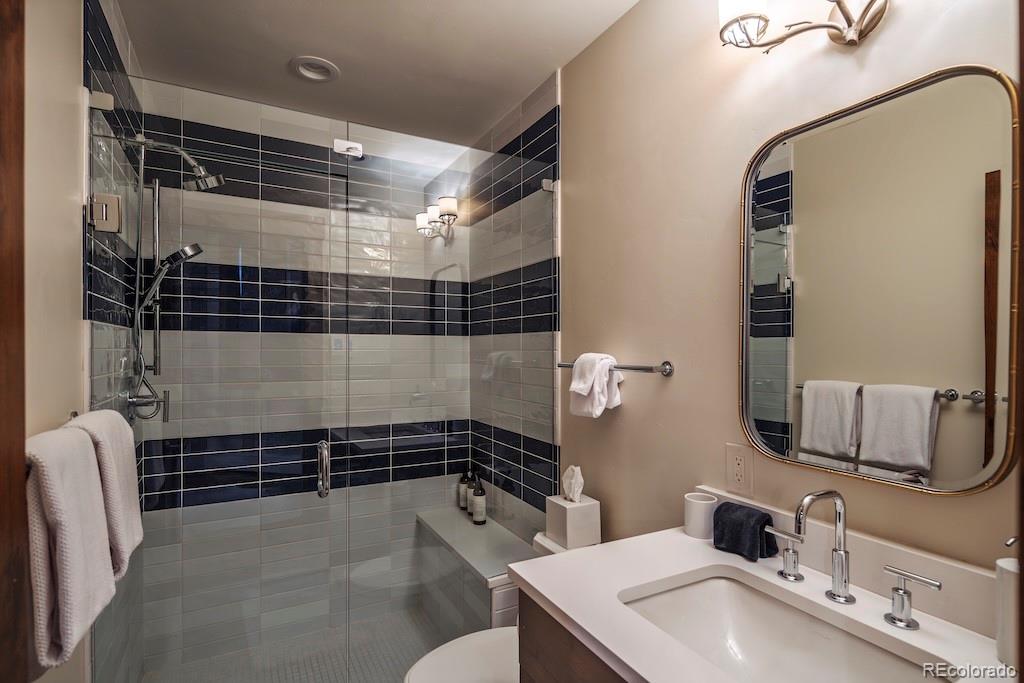 1670 Fallridge Place, Unit C11 Vail, CO 81657 - Photo 35 of 39 a bathroom with a sink toilet and shower
