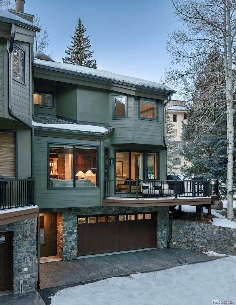 1670 Fallridge Place, Unit C11 Vail, CO 81657 - Photo 38 of 39 a front view of a building with a garden