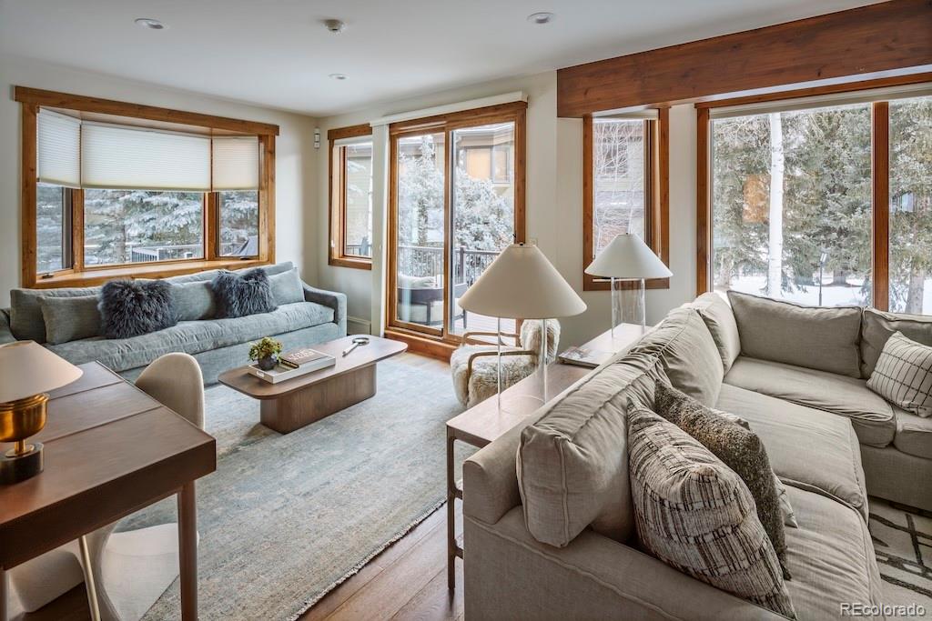 1670 Fallridge Place, Unit C11 Vail, CO 81657 - Photo 5 of 39 a living room with furniture and floor to ceiling windows