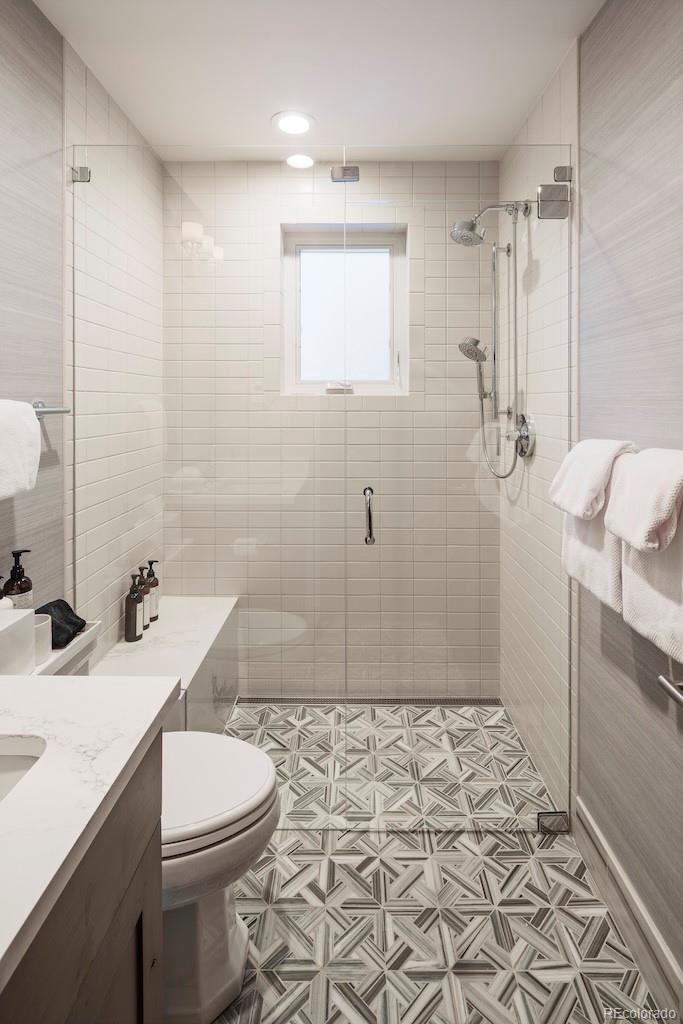 1670 Fallridge Place, Unit C11 Vail, CO 81657 - Photo 6 of 39 a bathroom with a sink a toilet and shower