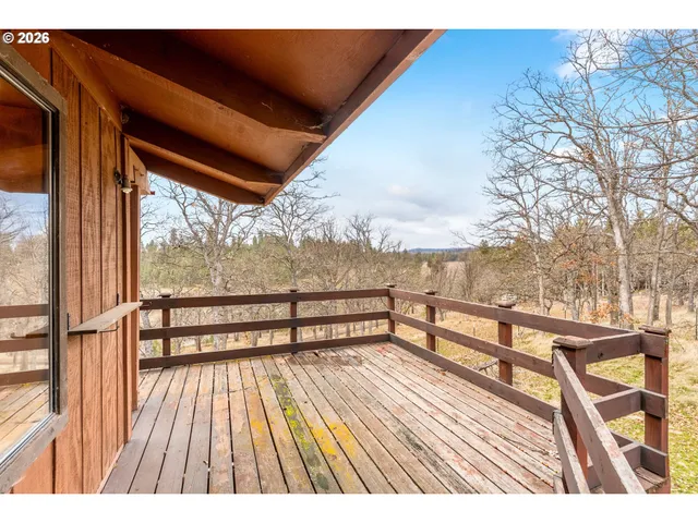 a dining room with furniture and large window