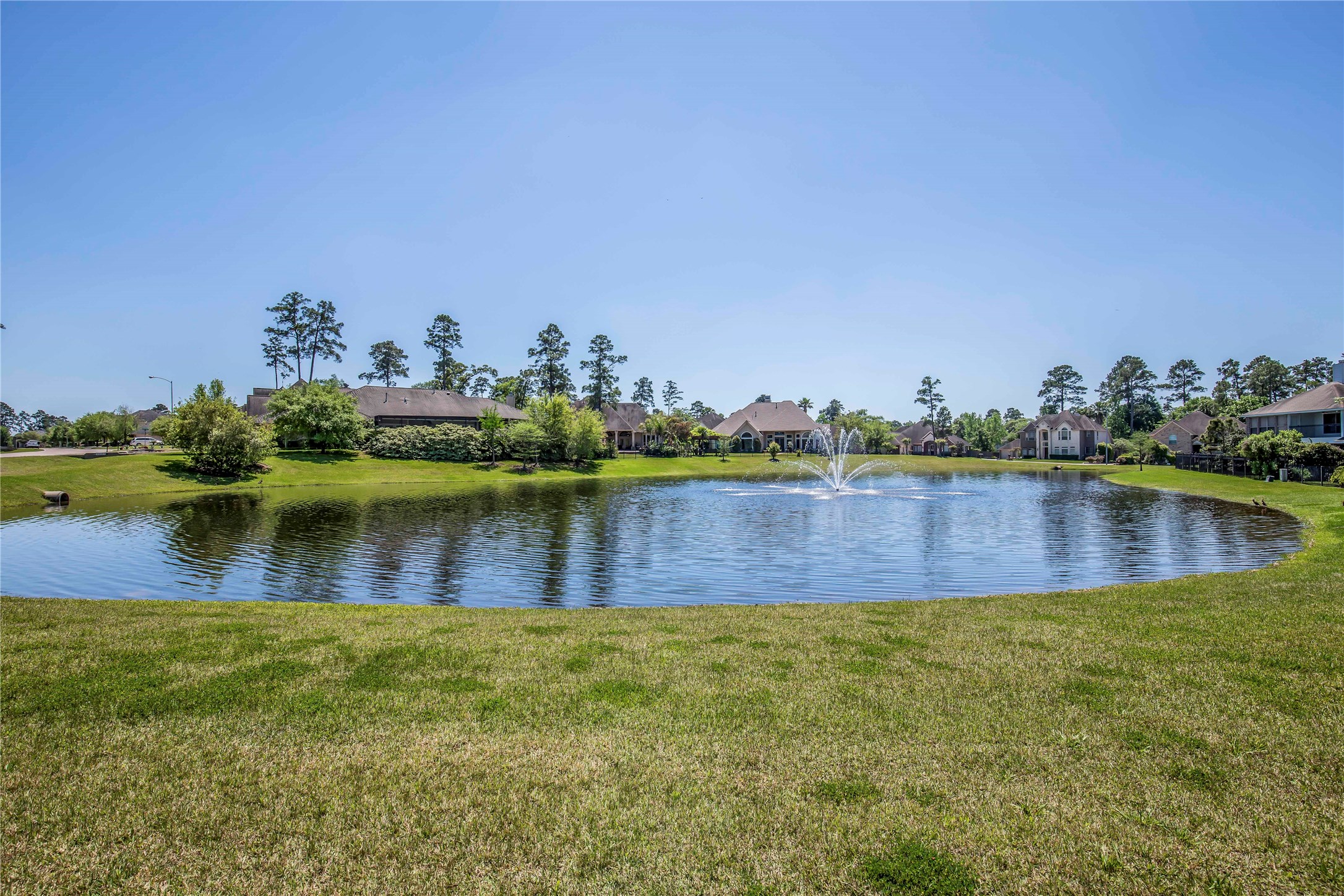 25219 Hideaway Run Drive Spring, TX 77389 - Photo 8 of 45 a view of a lake with houses in the back