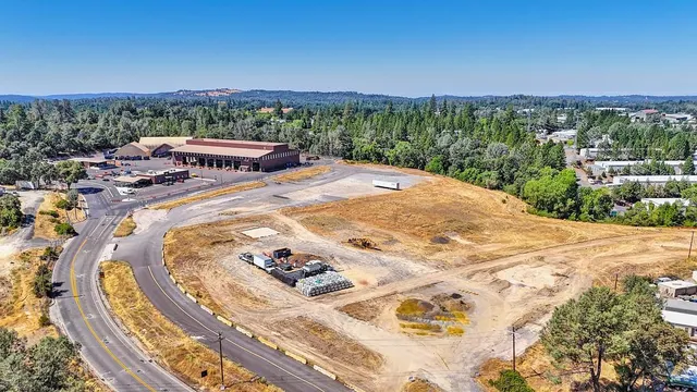 a view of a swimming pool with a yard and mountain view