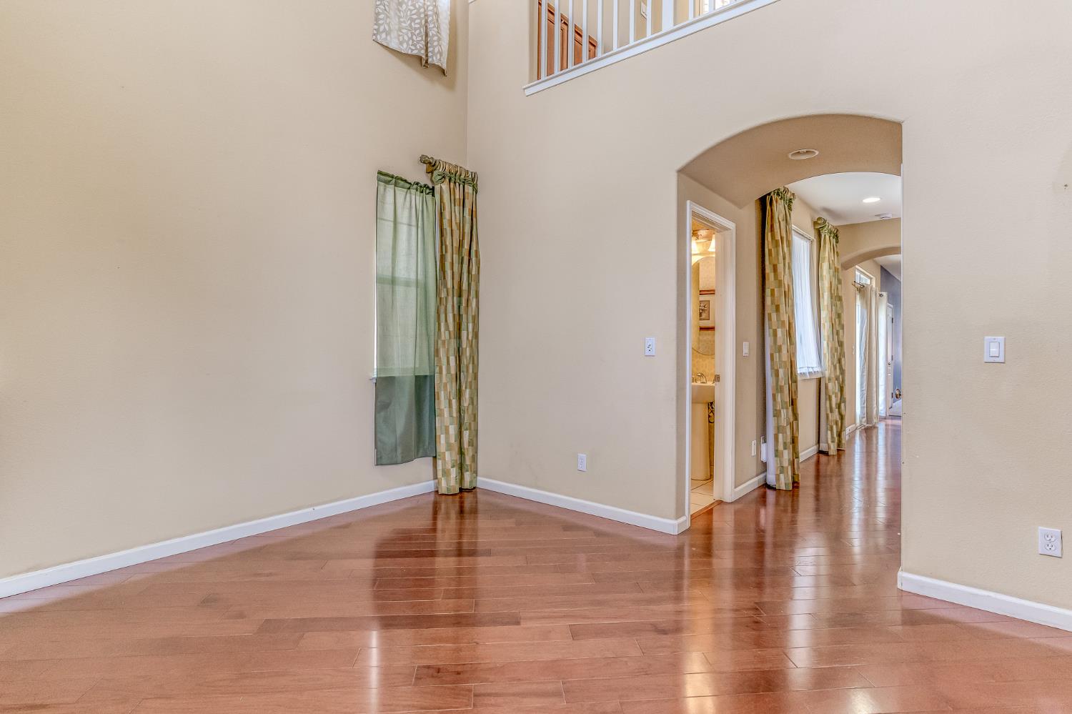 188 Thomsen Road Lathrop, CA 95330 - Photo 5 of 27 a view of livingroom with hallway and wooden floor