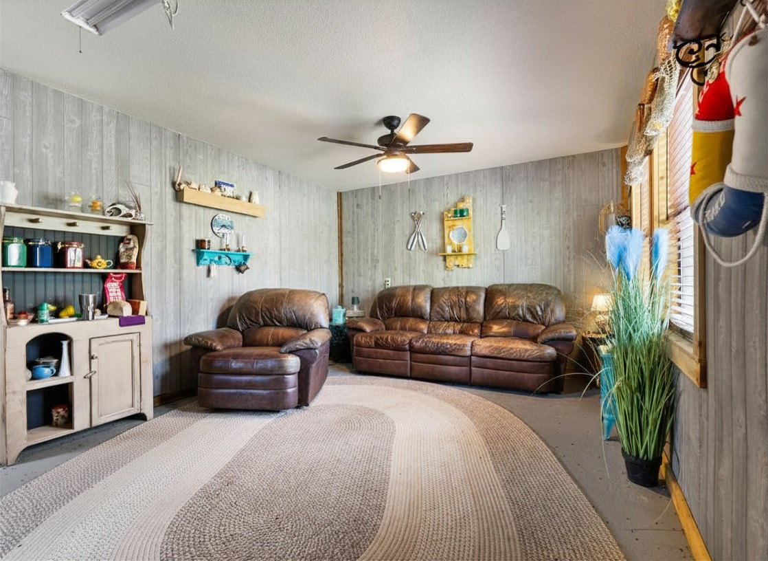 182 Smith Road Palacios, TX 77465 - Photo 10 of 23 a living room with furniture and a chandelier
