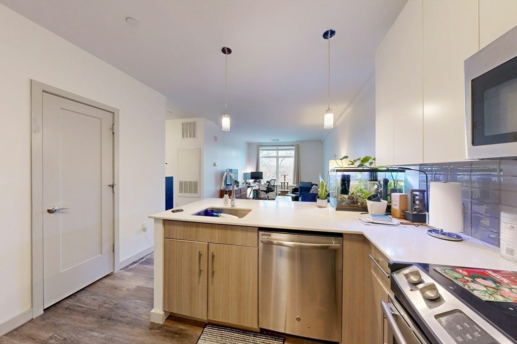 180 Telford Street, Unit 321 Boston, MA 02135 - Photo 4 of 16 a kitchen with a sink and cabinets