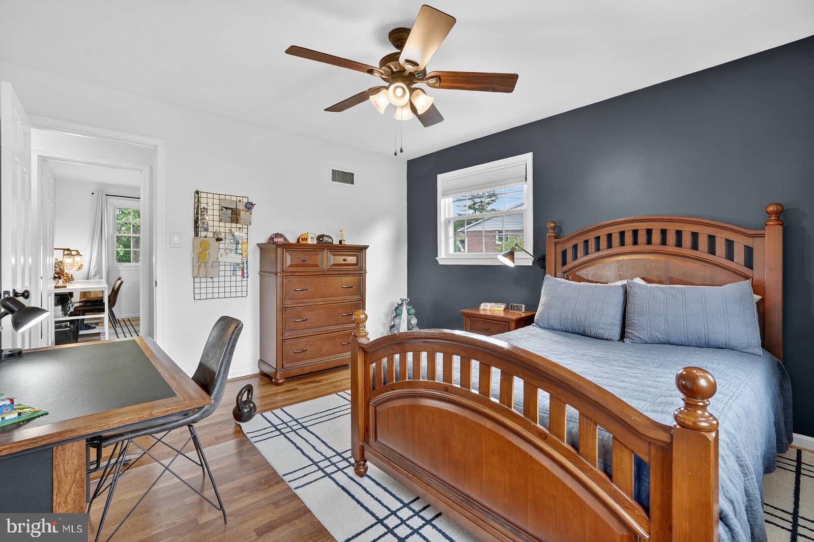 500 Finsbury Road Silver Spring, MD 20904 - Photo 28 of 54 a bedroom with furniture and a chandelier
