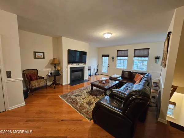 a living room with furniture windows and a fireplace
