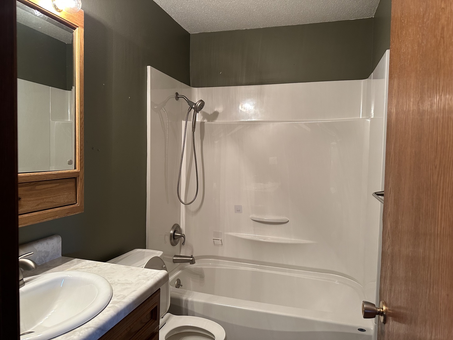 12855 Lawrence Road Sterling, IL 61081 - Photo 11 of 40 a bathroom with a sink toilet and shower