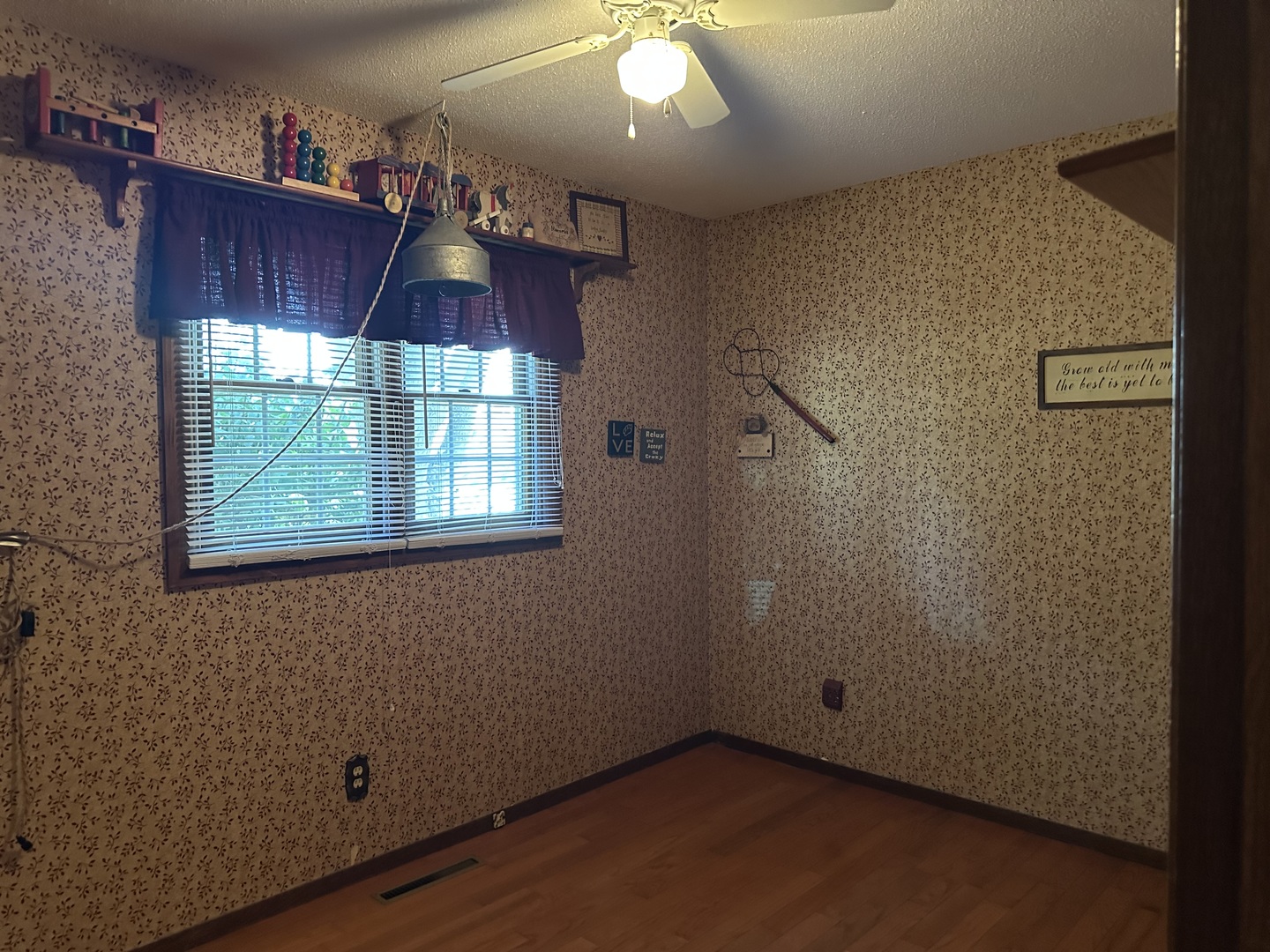 12855 Lawrence Road Sterling, IL 61081 - Photo 12 of 40 an empty room with wooden floor and windows
