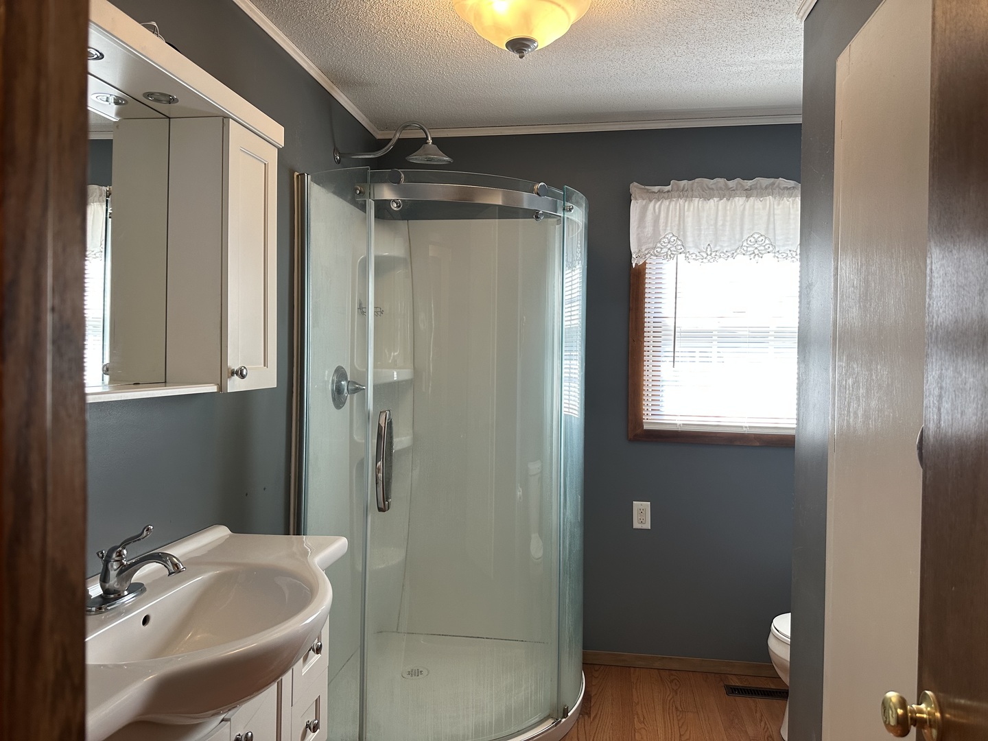 12855 Lawrence Road Sterling, IL 61081 - Photo 12 of 30 a bathroom with a sink and a mirror