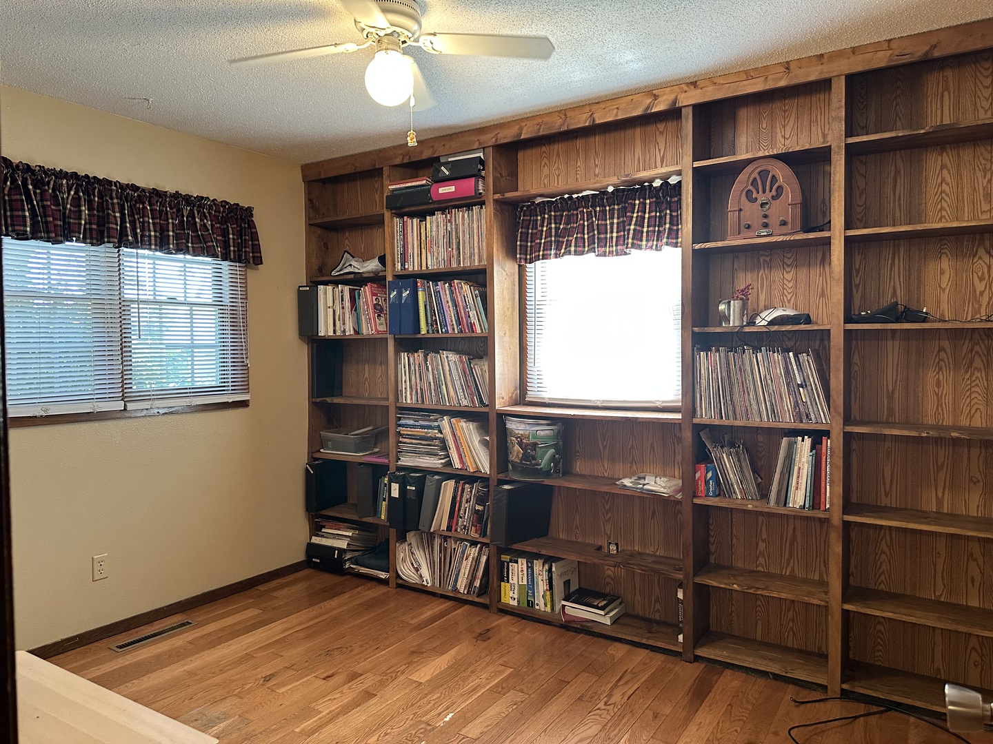 12855 Lawrence Road Sterling, IL 61081 - Photo 13 of 40 a view of an empty room with furniture and a book shelf