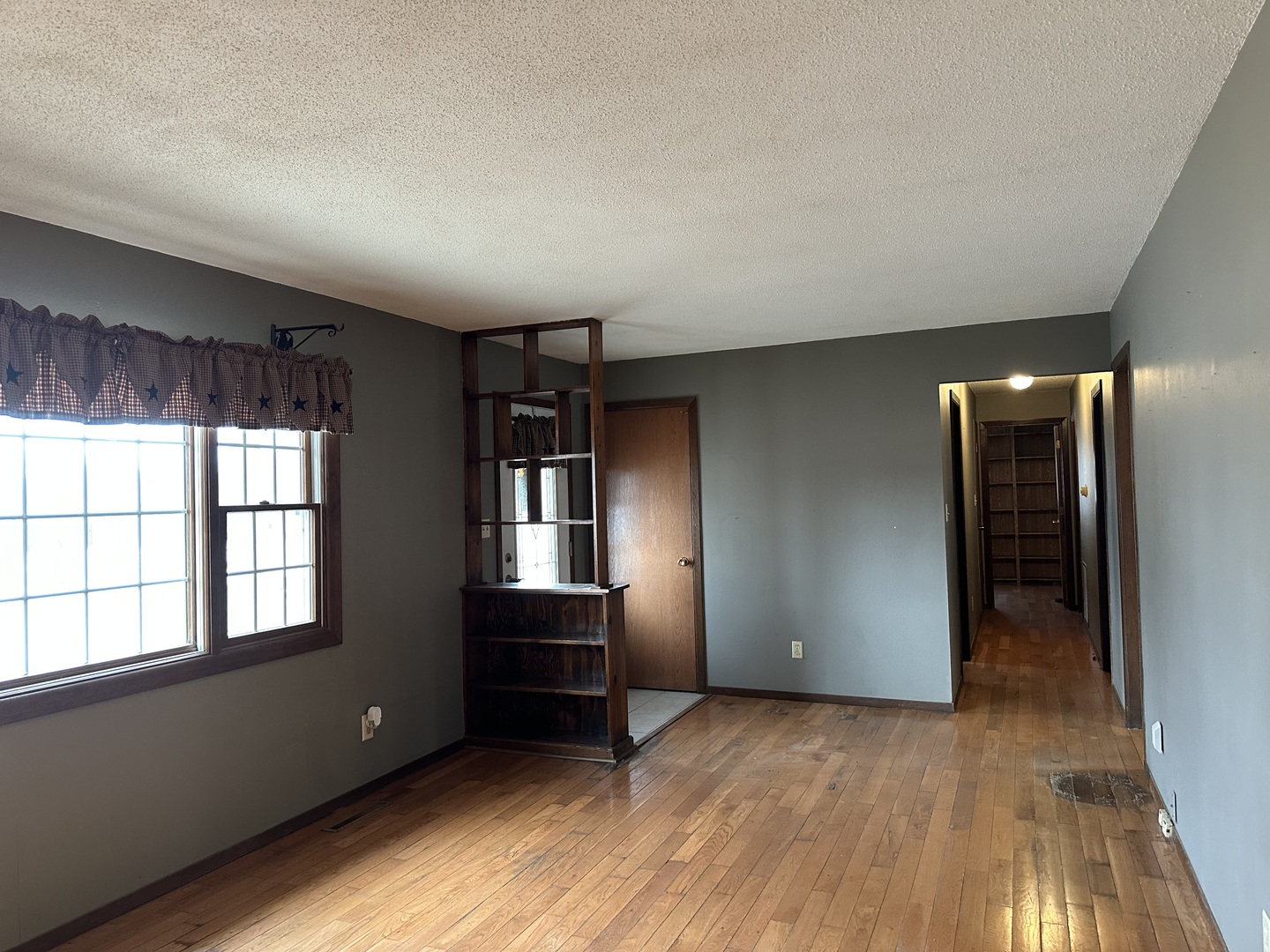 12855 Lawrence Road Sterling, IL 61081 - Photo 3 of 30 wooden floor in an empty room with a window