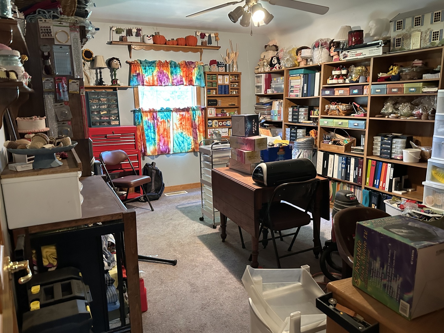 12855 Lawrence Road Sterling, IL 61081 - Photo 37 of 40 a room with furniture a bookshelf and a window