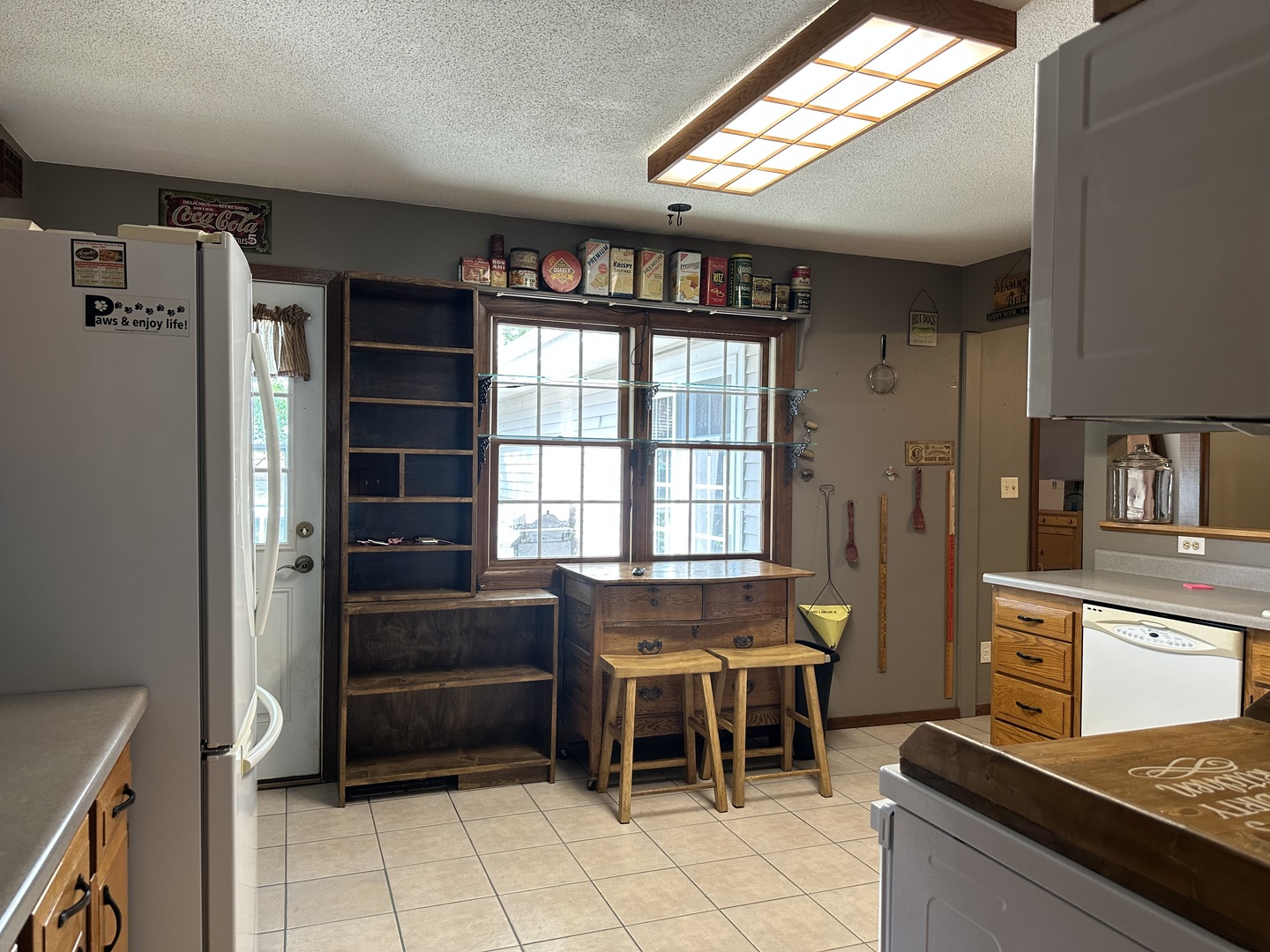 12855 Lawrence Road Sterling, IL 61081 - Photo 5 of 40 a kitchen with granite countertop a refrigerator and a stove top oven