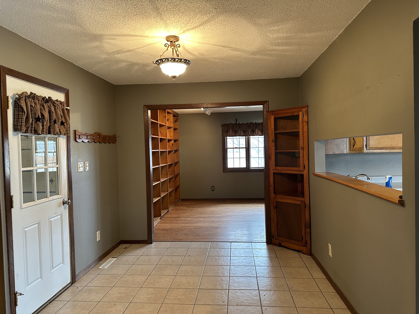 12855 Lawrence Road Sterling, IL 61081 - Photo 6 of 30 a view of a room with a fireplace and windows