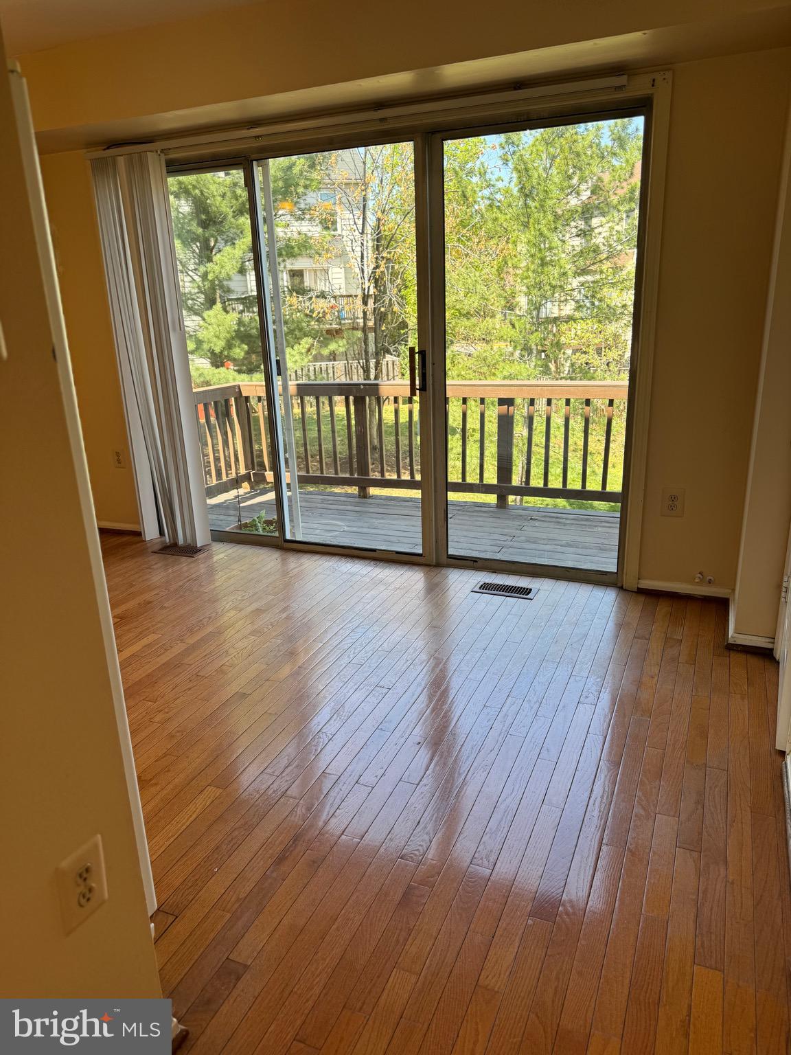 10424 Bermuda Lane Manassas, VA 20109 - Photo 11 of 32 a view of an empty room with wooden floor and a window
