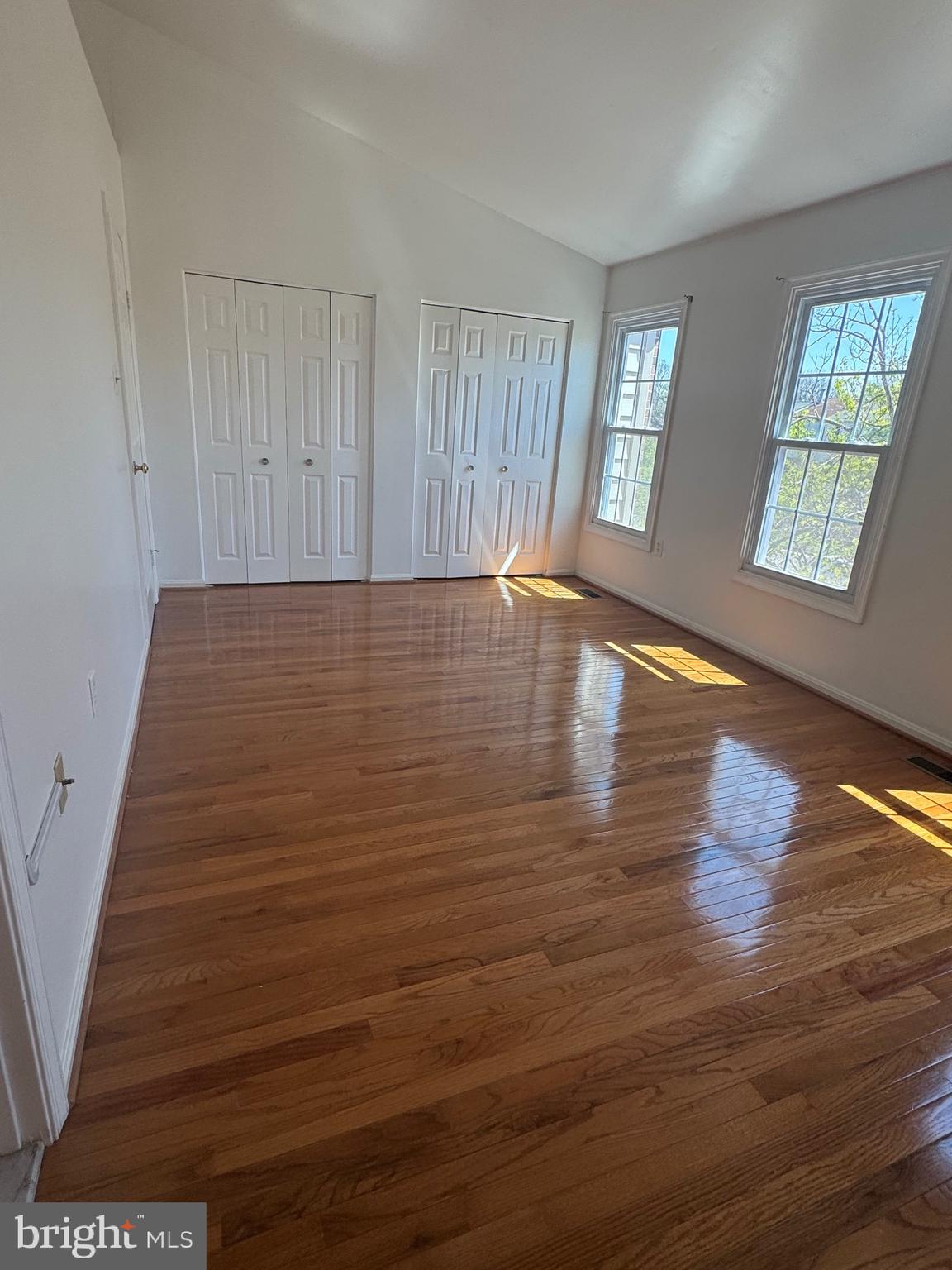 10424 Bermuda Lane Manassas, VA 20109 - Photo 16 of 32 an empty room with wooden floor and windows