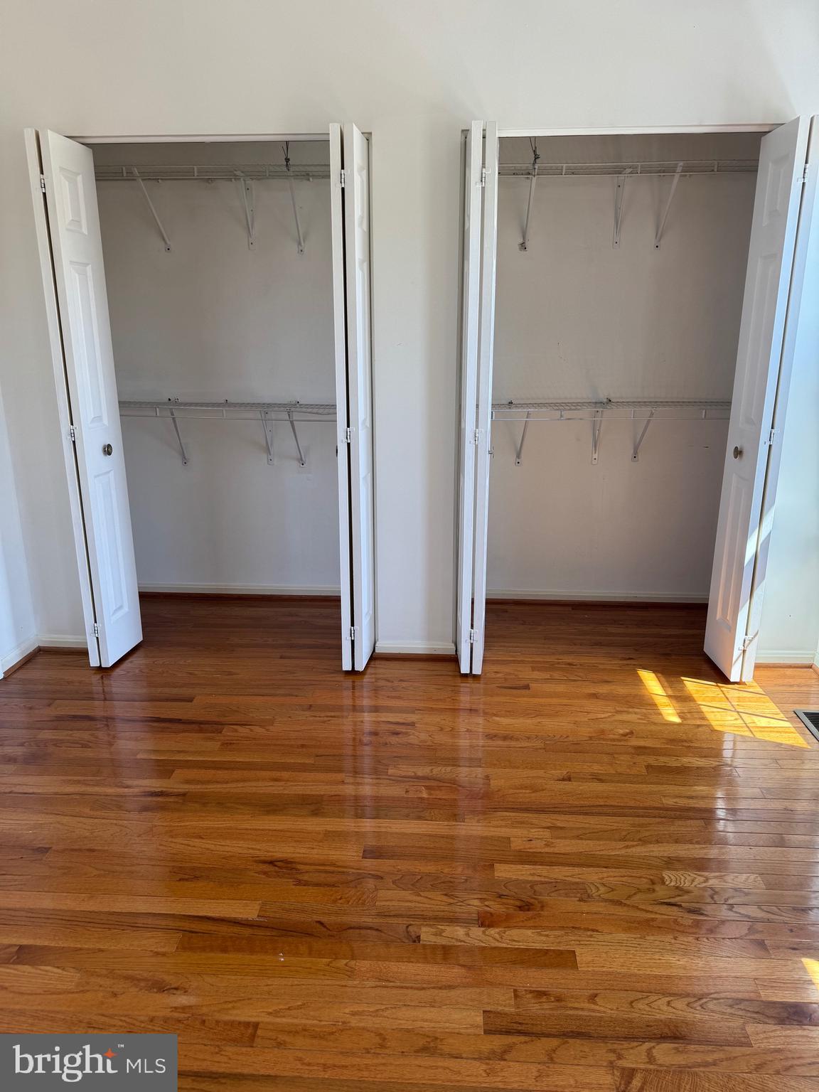 10424 Bermuda Lane Manassas, VA 20109 - Photo 18 of 32 an empty room with wooden floor and entrance