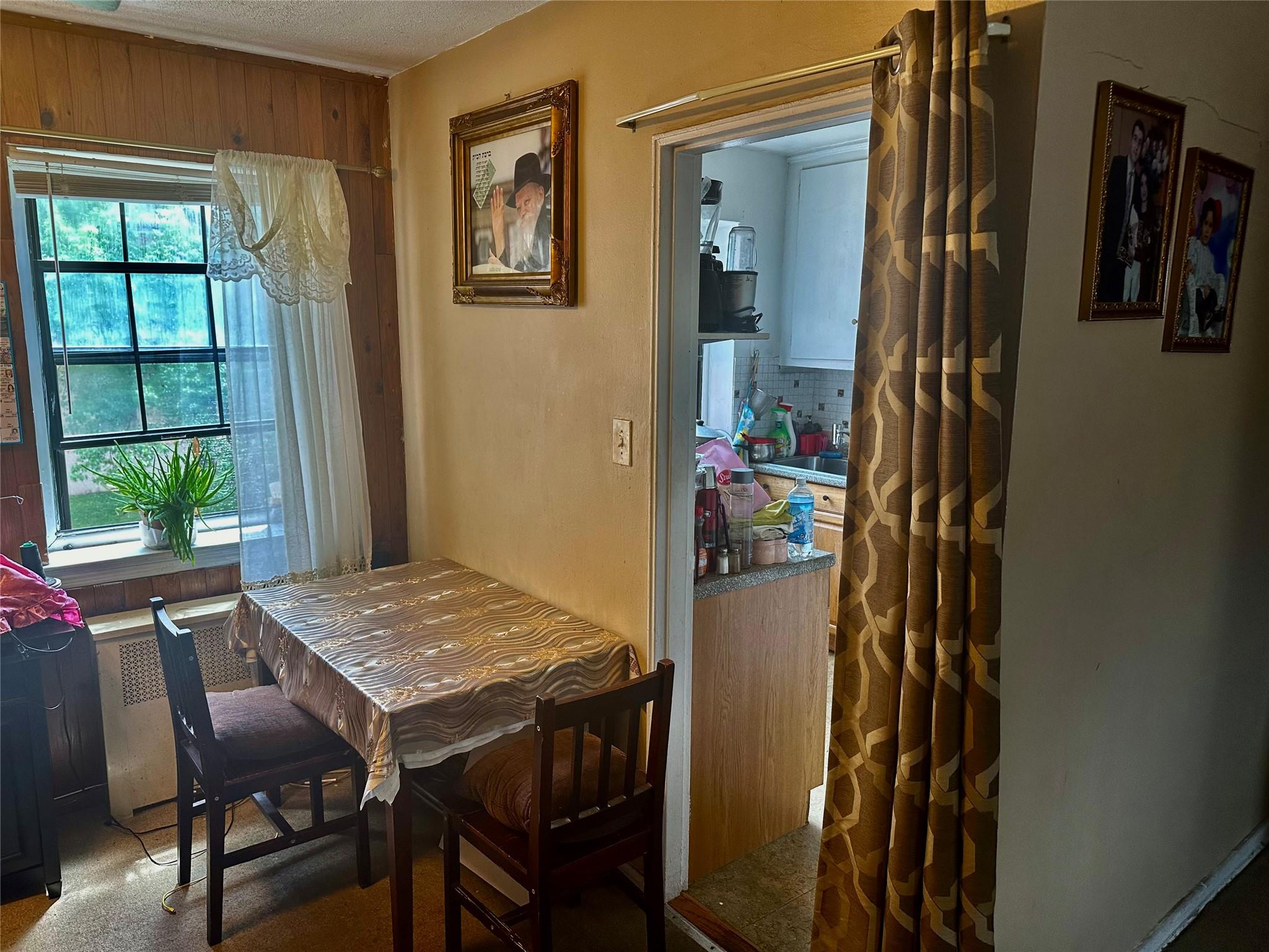 147-11 79th Avenue, Unit 3L Queens, NY 11367 - Photo 7 of 13 a view of a dining room with furniture window and outside view