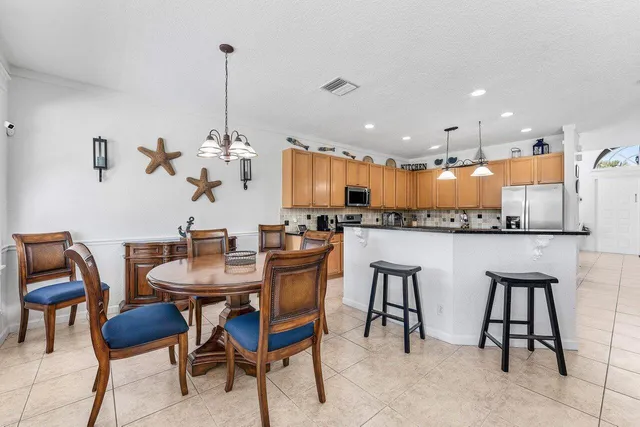 a living room with furniture and a ceiling fan