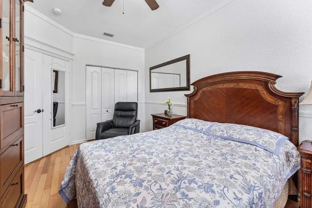 a bedroom with furniture and a window