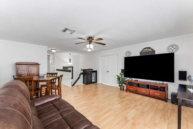 a kitchen with granite countertop white cabinets and sink