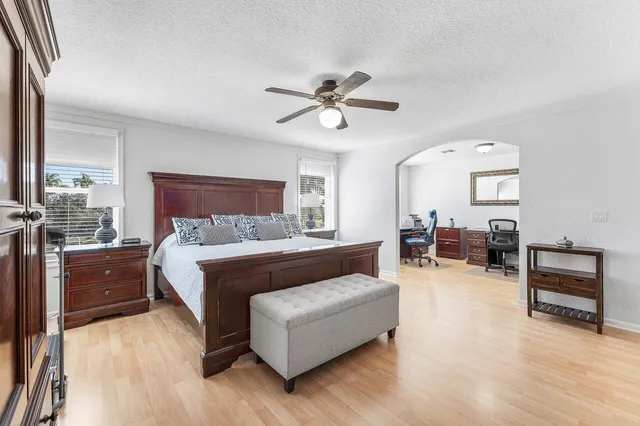 a bedroom with a bed and a dresser