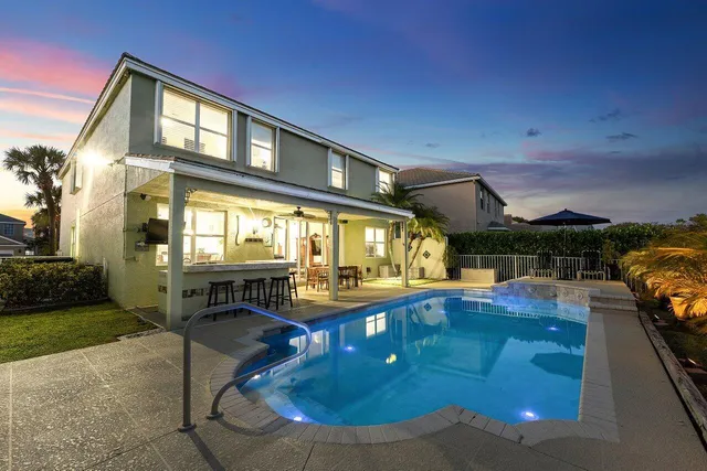 a view of a swimming pool with an outdoor seating