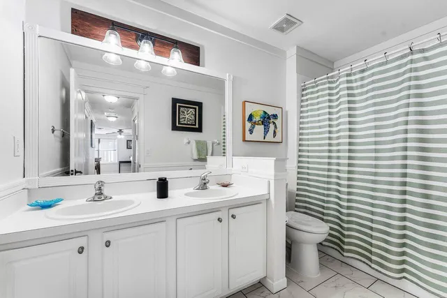 an aerial view of a house with a lake view