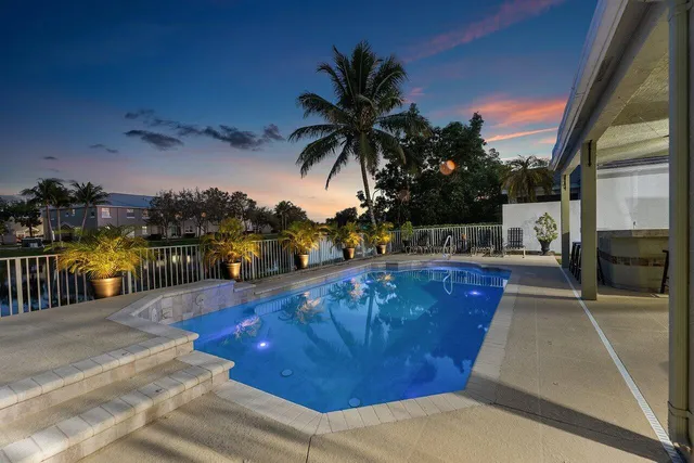 a living room with furniture and potted plant