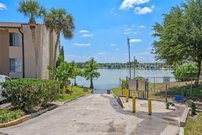568 Orange Drive, Unit 48 Altamonte Springs, FL 32701 - Photo 2 of 7 a view of a lake with sitting area