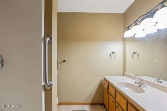a bathroom with a sink and mirror