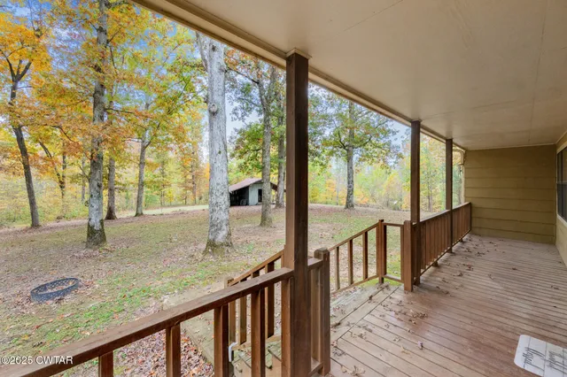 a view of a porch with wooden floor and floor