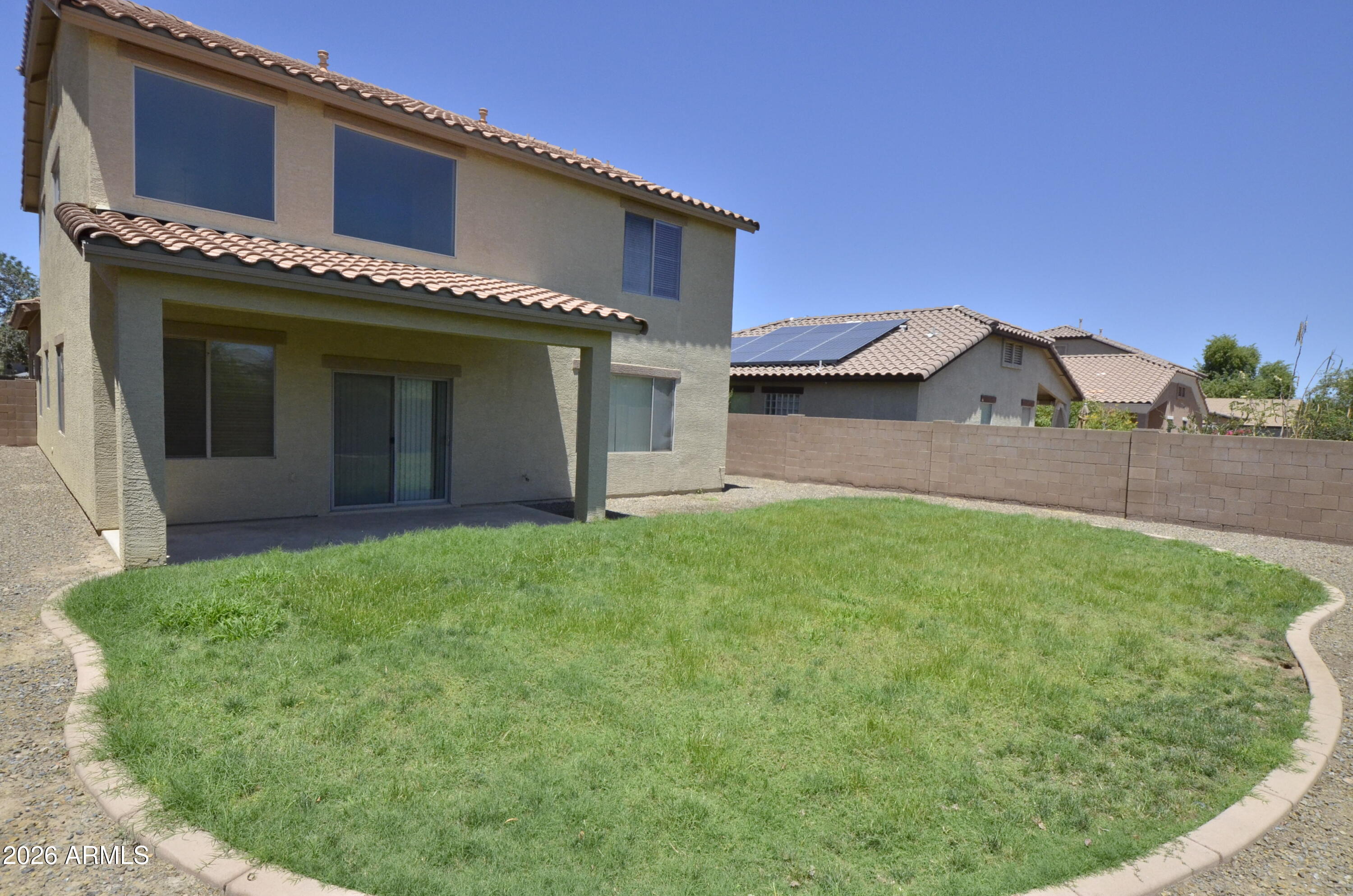 3995 East Trigger Way Gilbert, AZ 85297 - Photo 21 of 23 a view of a house with a yard and garage