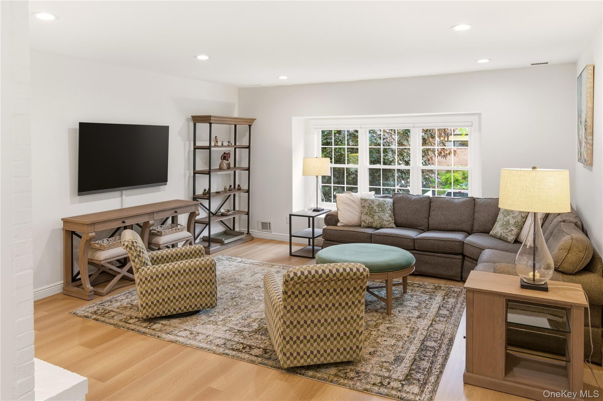 44 Hidden Ridge Drive Syosset, NY 11791 - Photo 4 of 28 a living room with furniture and a flat screen tv