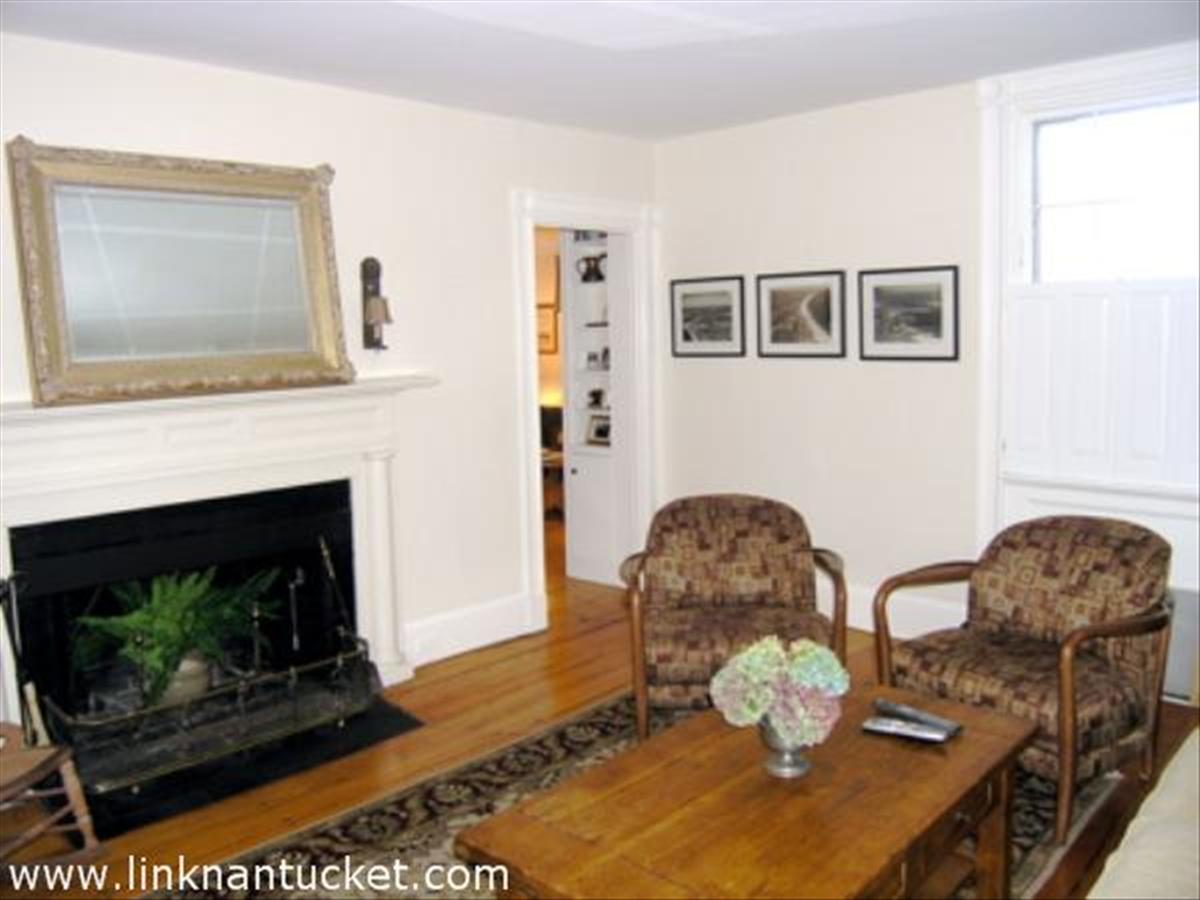 16 Vestal Street Nantucket, MA 02554 - Photo 5 of 10 a living room with furniture and a fireplace
