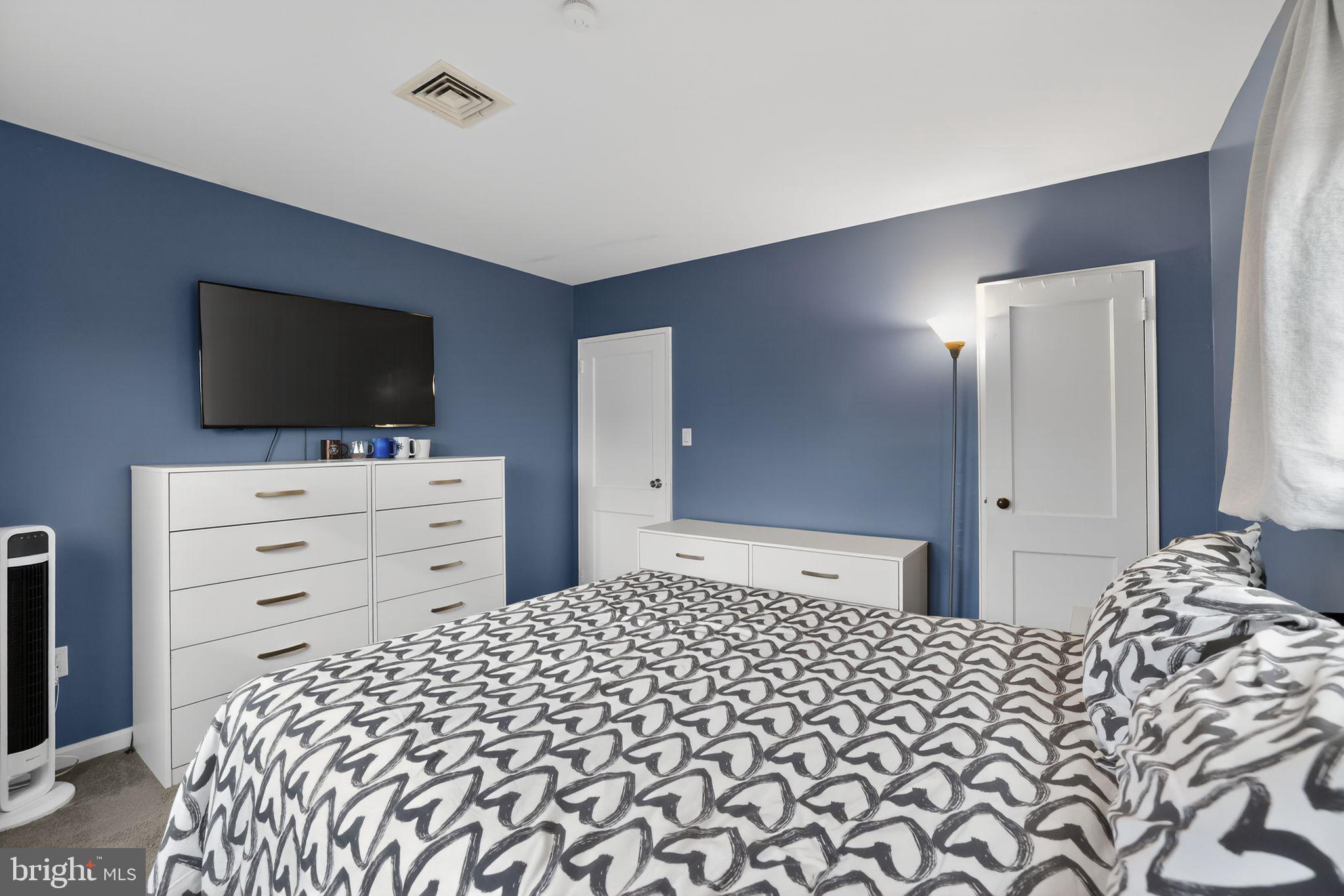 313 West Walnut Street Pottstown, PA 19464 - Photo 14 of 31 a bedroom with a bed and a flat screen tv