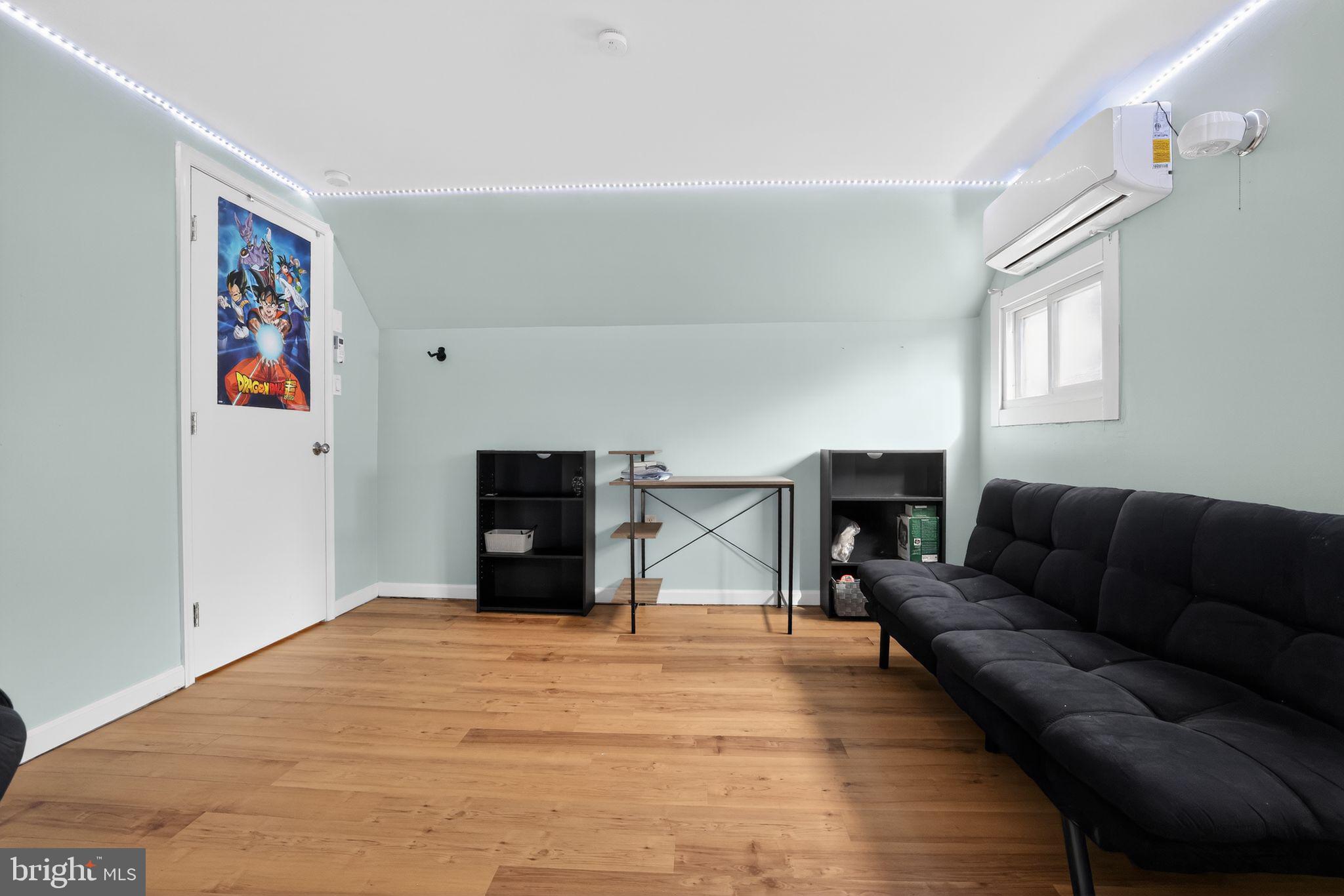 313 West Walnut Street Pottstown, PA 19464 - Photo 18 of 31 a living room with furniture and a flat screen tv