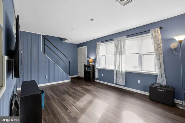 a view of a livingroom with furniture and window