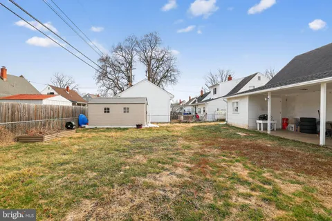 a view of a house with a yard and garage