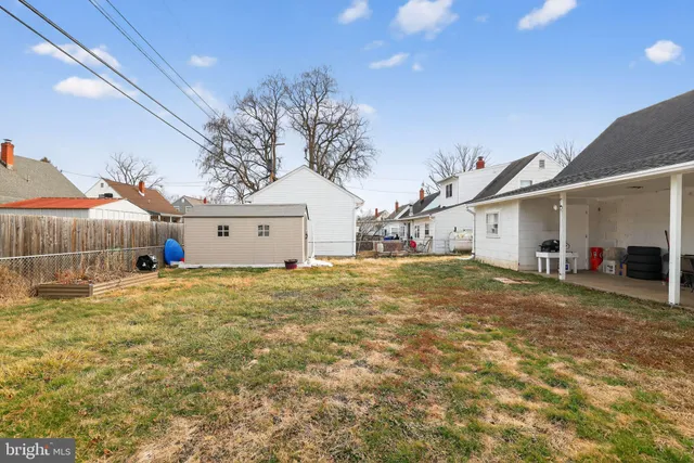 a view of a house with a yard and garage