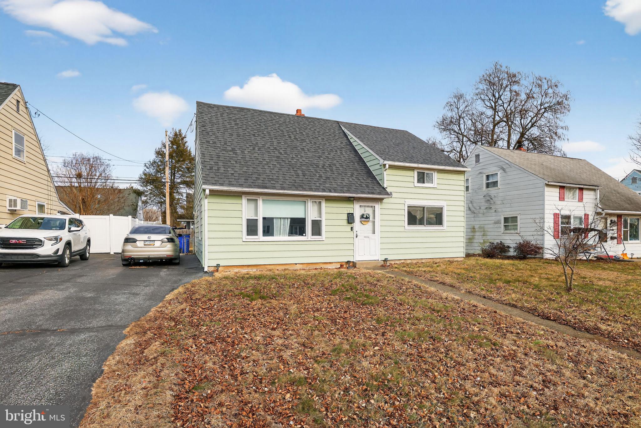 313 West Walnut Street Pottstown, PA 19464 - Photo 30 of 31 a front view of a house with a garden